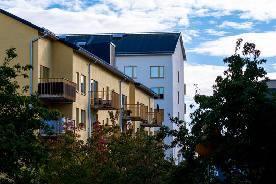 Residential street with modern apartment buildings and trees in the district of Stora Ursvik Stockholm Sweden showing sustainable design