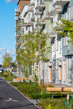 Pedestrian street with modern residential buildings and green spaces in the district of Stora Ursvik Stockholm Sweden representing contemporary urban life