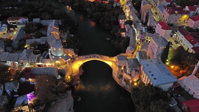 Aerial view on the Old Bridge in Mostar at night, Bosnia and Herzegovina, 4k