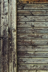 Fototapeta premium background of old weathered and cracked boards with peeling paint of brown color