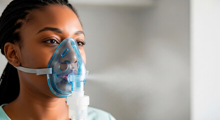 Black woman using a nebulizer mask for respiratory therapy. Patient receiving asthma or allergy treatment. Healthcare and medical concept with copy space