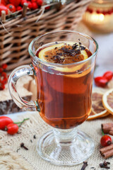 Hot tea on the table, against the background of beautiful autumn decorations.