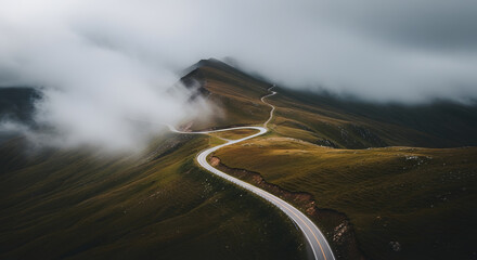 Curving Mountain Road Through Misty Hills