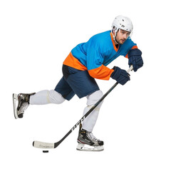 Obraz premium Ice Hockey Player in Action with Puck and Stick.