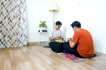 Two Friends Enjoy Thoughtful Game Of Chess Together