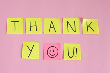 Flat Lay Of Sticky Notes And Happy Smiley Face Against Pink Background