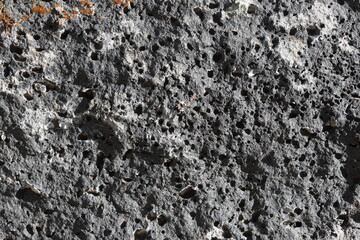 Macro View of Basalt Stone Surface Texture. Rough Surface of Natural Basalt Stone in Focus