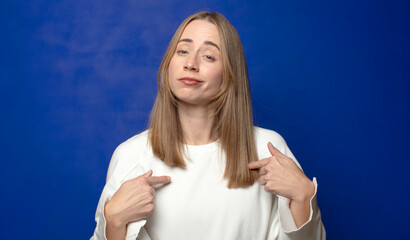 looking proud, arrogant, happy, surprised and satisfied, pointing to self, feeling like a winner