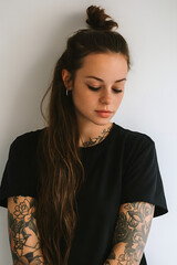Tattooed Woman with Freckles and Floral Arm Ink &ndash; Portrait Against White Background.