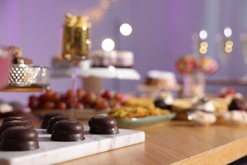 Buffet menu. Different delicious desserts on table, selective focus
