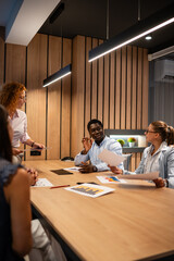 Diverse business team collaborating during creative office meeting
