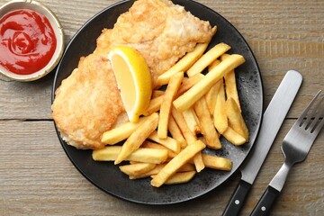 British Traditional Fish and chips served on wooden table, flat lay