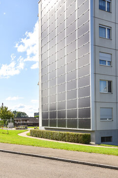 Apartment Building with Solar Panel Facade in the Countryside near Zurich, Switzerland