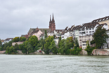 Traditional Houses and Church along Riverfront in Basel, Switzerland