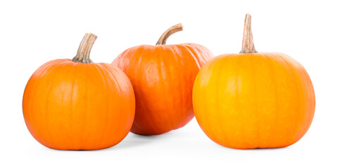 Three whole ripe pumpkins isolated on white