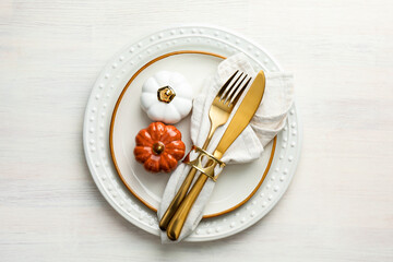 Beautiful table setting with autumn decor on white wooden background, top view