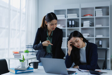 Frustrated boss seeing a mistake pointing a finger, scolding a stressed employee experiencing...