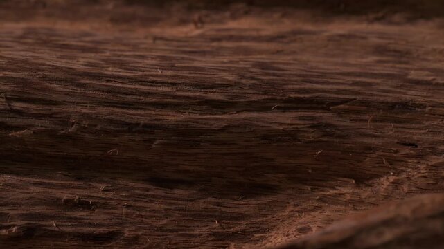 Detailed footage of agarwood texture shot, capturing the fine grain and natural surface