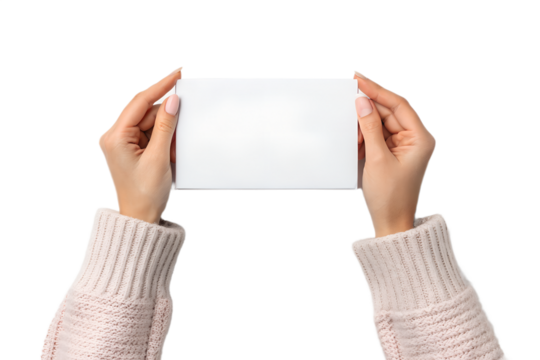 Female hands in a cozy sweater holding a blank white horizontal card or sign, isolated on a transparent PNG background. Perfect mockup for inserting custom text, branding, invitations, announcements, 