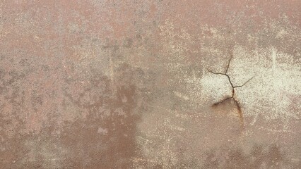 Old car paint surface with cracks, rust stains, and faded texture, showing uneven reddish-brown...