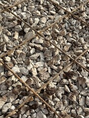 Crushed stone with reinforcing mesh. Preparation for pouring the concrete base. Metal fittings. Vertical