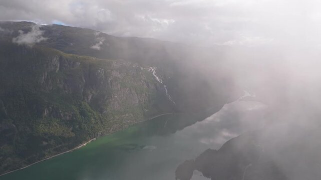 Aerial perspective of Odda and nearby mountains and coastline