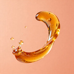 Golden liquid splash in midair