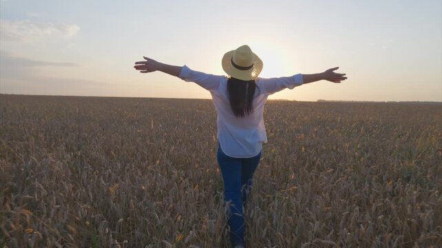 A Joyful and Relaxing Moment in a Beautiful Wheat Field Beneath a Gorgeous Sunset Sky