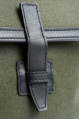 Close-up of buckle of  a retro leather bag
