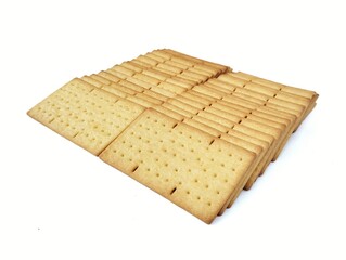 Pile of square biscuits cracker isolated on white background. High angle view 