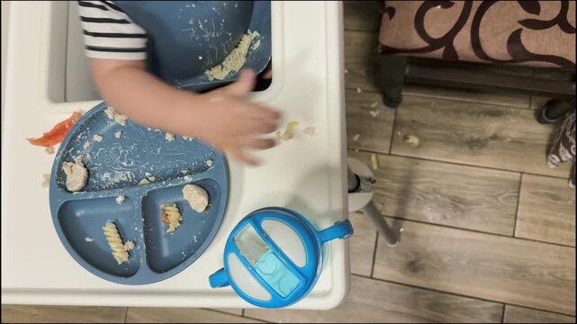 Baby's Mealtime Mess with Plate and Sippy Cup
