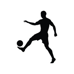 silhouette of a soccer player kicking ball full
