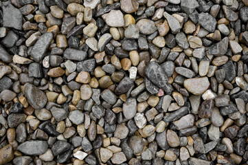 Natural stones background with mixed textures and colors.