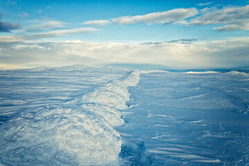 Long Line of Sculpted Rime Ice and Snow Drifts on Arctic Plateau