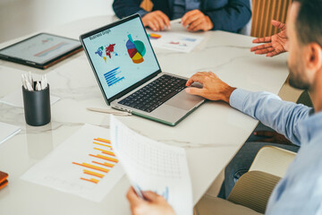 Business people sharing ideas inside company office - Multiracial colleagues discussing new financial project - Data analysis and corporate concept - Main focus on man right hand