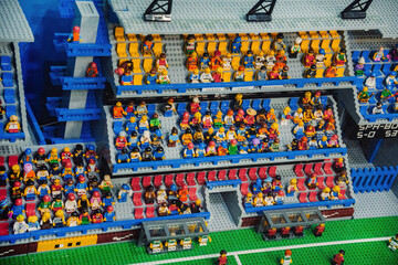 Naklejka premium Prague, Czechia - September 20, 2025: Colorful LEGO football stadium packed with cheering fans
