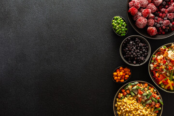 A variety of frozen vegetables and fruits arranged in plates, set against a dark background, capturing the essence of summer preservation for winter meals