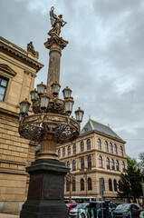 Neoclassical column at the front of the Rudolfinum concert hall in Prague, Czech Republic, captured on an overcast day