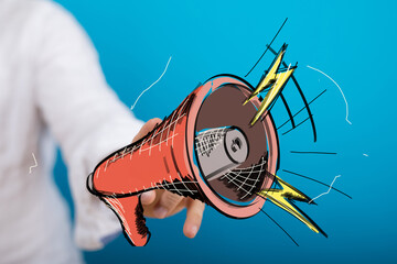 Sketch of a hand holding a megaphone.  Ideal for marketing, advertising, and communication concepts.