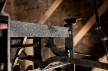 Antique church clock mechanism with metal gears. Perfect for illustrating vintage machinery, time concepts, history, or industrial design.