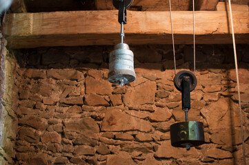 Antique church clock mechanism with metal gears. Perfect for illustrating vintage machinery, time concepts, history, or industrial design.