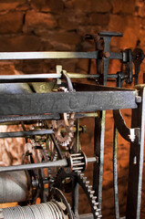 Antique church clock mechanism with metal gears. Perfect for illustrating vintage machinery, time concepts, history, or industrial design.