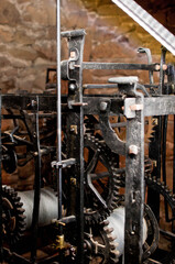 Antique church clock mechanism with metal gears. Perfect for illustrating vintage machinery, time concepts, history, or industrial design.