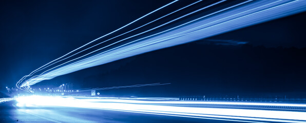 blue car lights at night. long exposure