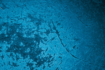 blue old aluminum sheet with burnt marks from the pan