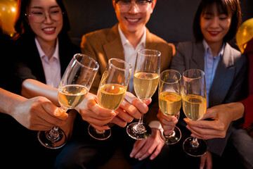 A group of beautiful girls at a company party, drinking, celebrating New Year, club party with friends.