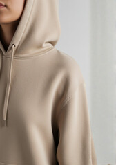young woman in a white shirt. clothes on hangers, Light pink oversized hooded sweatshirt with a front pocket, isolated on a white background of mockup, t shirt hanging on hangers