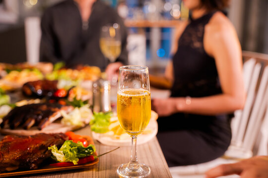 Wedding, couple at celebration party with friends and family, happy and smiling toasting champagne glasses, happy celebration concept.