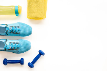 Sport fitness tolls flat lay with sneakers and dumbbells, top view