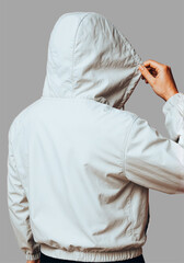 transparent Close-up of Beige Hoodie - Young man wearing a green hooded sweatshirt, looking to the side with a hand on his chest of mockup